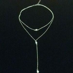 Necklace layered with crystals.